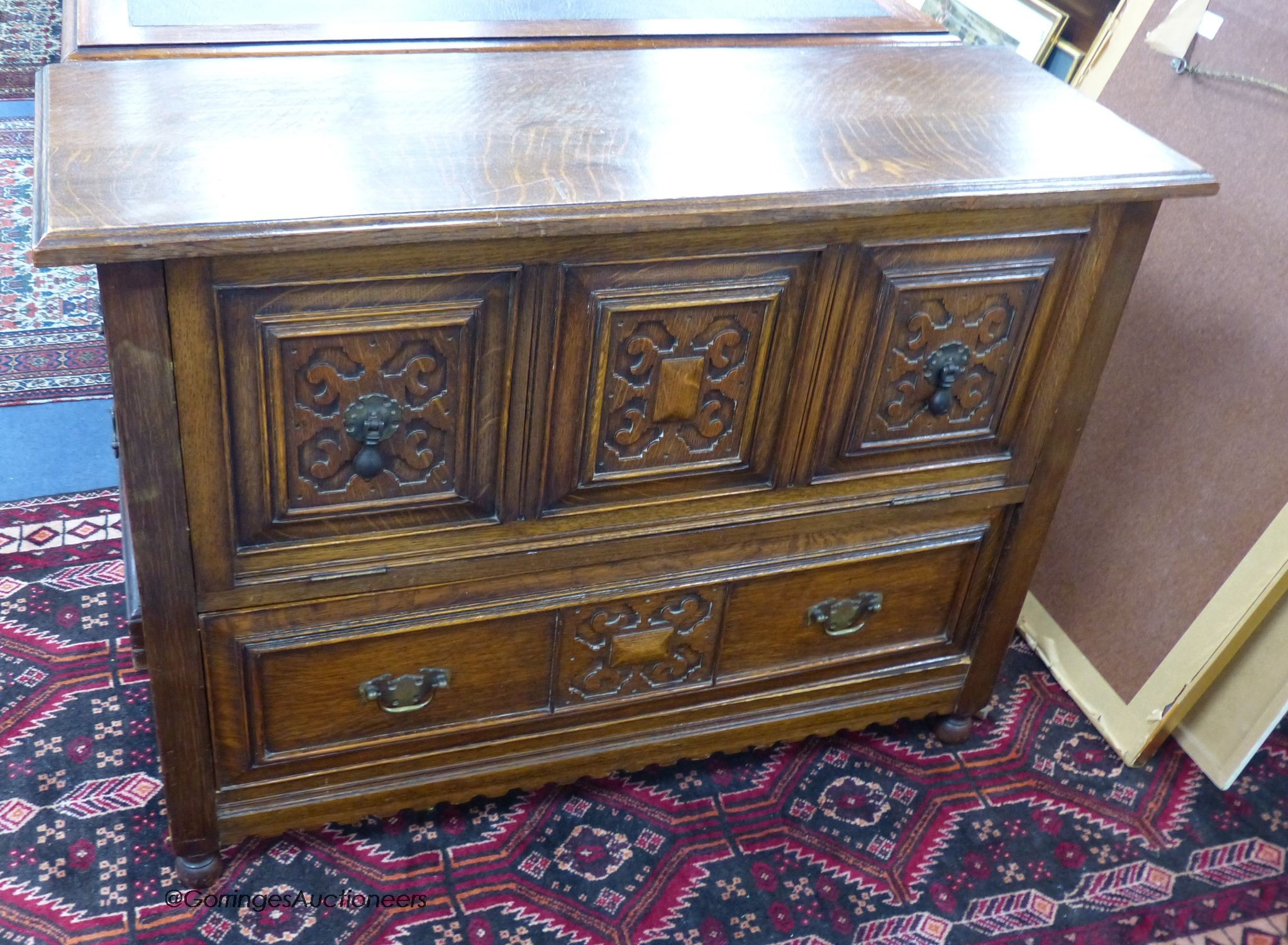 A low oak cabinet, length 99cm, depth 35cm, height 74cm